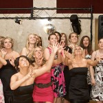 Shelley’s daughter Alyssa (front row, on left, in black dress) is the fourth generation in the Becker family to work at the store. She used a cropped version of this bouquet-toss photo as her Facebook profile picture.